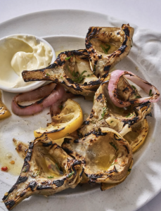 Grilled artichokes with charred lemon, pickled red onion and aioli at Via Carota, New York